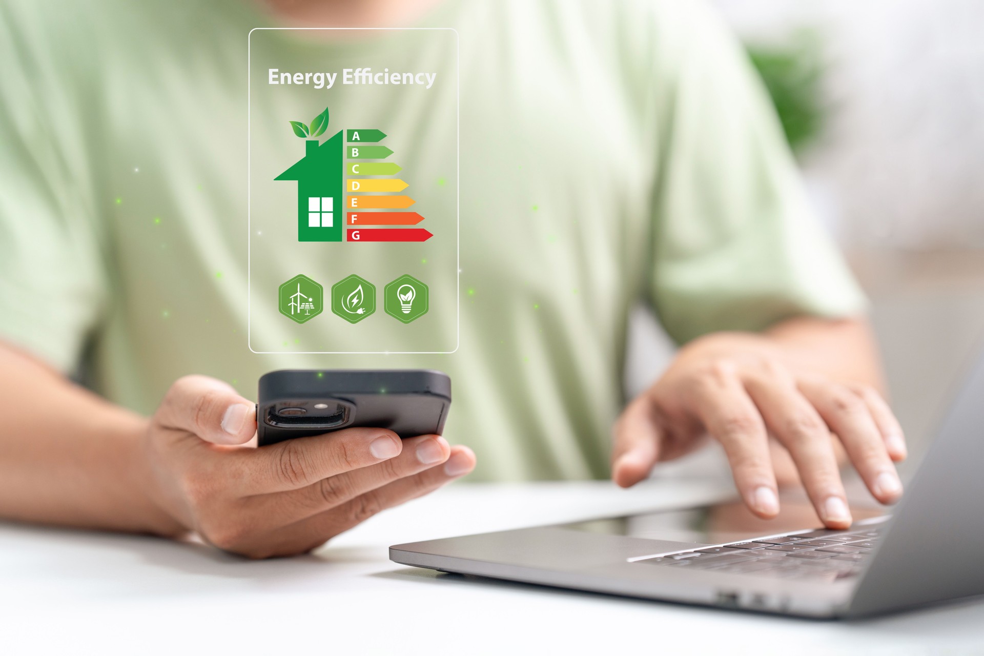 Energy efficiency rating and eco home renovation insulation performance concept. Energy efficiency mobile app on screen. Ecology, eco house and bioenergetic house, efficiency scale.